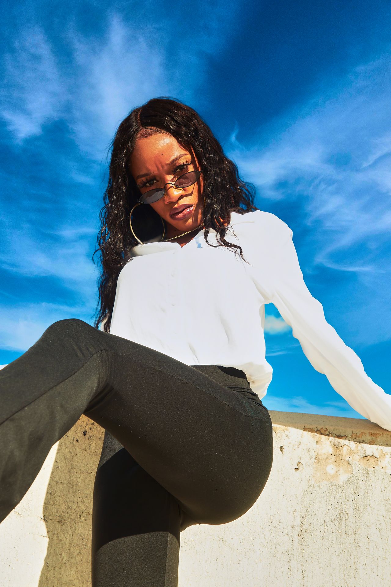 black women in outdoor portrait photography with natural lighting on rooftop